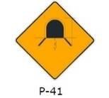 La siguiente señal (P-41), le indica: 
a) Que usted se aproxima a una zona de camiones. 
b) Que usted debe encender sus luces pues se aproxima a una zona con poca visibilidad. 
c) Que usted se aproxima a un túnel. 
d) Ninguna de las alternativas...