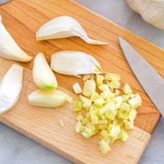 Garlic: a plant of the onion family that has a strong taste and smell and is used in cooking to add flavour: