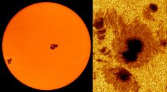 Sunspots are regions on the solar surface that appear dark because they are cooler than the surrounding photosphere