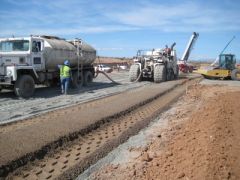  a construction material, a mix of pulverized natural soil with small amount of portland cement and water, used as a construction material for pipe bedding, slope protection, and road construction as a subbase layer reinforcing and protec...