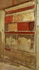 Relief of an imitation of a wall made out of painted blocks (3rd c. B.C.) Appears in the Basilica of Pompeii, House of the Faun.