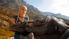 EC Emilia Clarke petting a dragon
