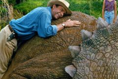 SN Sam Neill hugging a triceratops