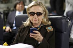 HC Hillary Clinton texting on her phone