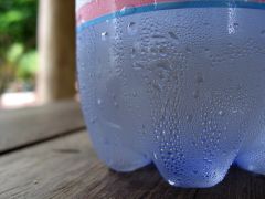 The change of water from its gaseous form (water vapor) into liquid water.