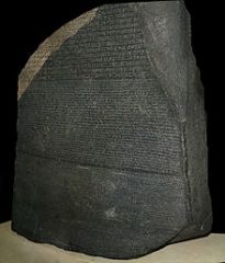 - An ancient Egyptian granodiorite stele inscribed with a decree 
- Issued at Memphis in 196 BC on behalf of King Ptolemy V
- The decree appears in three scripts: the upper text is Ancient Egyptian hieroglyphs, the middle portion Demotic script,...