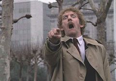 Donald Sutherland

Pointing at non-body snatched humans, wearing tan overcoat