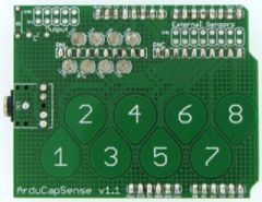 The ArduCapSense Shield adds 8 capacitive sensing buttons and an audio output jack to your Arduino. Uses the Arduino CapSense library written by Paul Badger.   Use the buttons to do any of the following: