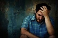 the state of undergoing pain- distress- or hardship