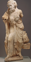 Greek Hellenistic period, 323-31 BCE 
- copy of a Greek work of the 2nd Century 
- appears to be an aging, dissolute follower of Dionysos, on her way to a religious festival. 