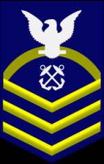 Chief Petty Officer - CPO


ZERO ONE gold rocker, ZERO THREE gold chevrons, a rating designator, and a white eagle on a field of blue.