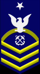 Senior Chief Petty Officer - SCPO


ZERO ONE gold rocker,

ZERO THREE gold chevrons, a rating designator, a white eagle, and ZERO ONE white star on a field of blue.