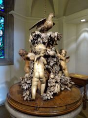 In which church is there a wooden font cover by Grinling Gibbons ?
