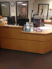 Location in library where you check in/out books, renew items, find items, ask for help with anything in the library.