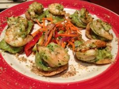-House-made crispy tostada rounds ("Navajo rounds")
-topped with fresh hand-hacked guacamole
-a dash of chipotle and 
-cilantro pesto marinated grilled shrimp
**sprinkled with crunchy toasted Pumpkin Seeds
**Served with spicy cucumber salad
...