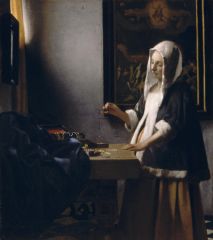 Woman Holding A 
Balance - Vermeer