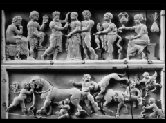 What
type of imagery is on the Veroli Casket? What figures are added into the animal scene of Sacrifice
of Iphigeneia that makes it a parody of classical art?
