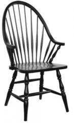 This ____________ chair with its back of slim turnings held by a bent hoop, a wooden saddle carved seat, and legs that were usually turnings with turned stretchers came into wide use during the _____________ period.