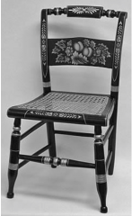 A highly individual style of chair design was developed by ________________
, who established a factory
to produce what he called ________________
based on Federal or Regency styles. They had turned wooden front legs, a rush seat, and simple ladde...