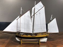 a small sailing vessel with two or three masts and a lugsail on each