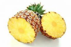 (the yellow flesh and juice of) a large tropical fruit with a rough orange or brown skin and pointed leaves on top