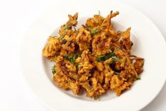an Indian dish of fried vegetables [n -s]