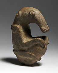 Formal Analysis: The Ambum Stone, Ambum Valley Enga Province, Papua New Guinea, 1,500 BCE, carved stone, #9
 
Content: The Ambum Stone appears to be a depiction of some sort of ancient anteater or similar animal. The rounded belly allows for the p...