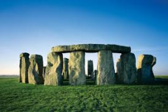 What celestial event is Stonhenge aligned to? Describe what happens to Stonehenge on this day.