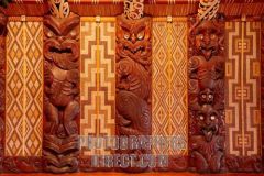 New Zealand art where Maori women working in pairs weave stripes of dyed flax into geometric patterns and are made to fit between the wooden uprights of meeting houses where religious ceremonies are held.
 
Ex. Tukutuku panels