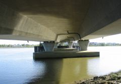 A large girder, hollow like box columns, and often used for highway bridges.