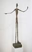 A form whose contour is irregular or broken, having a sense of growth, change, or unresolved tension; form in a state of becoming
 
Ex. Alberto Giacometti - Man Pointing