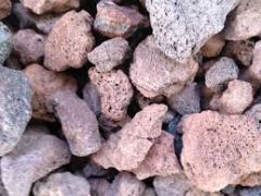 
vesicular gravel , small and glassy, falls as a solid, common on cindercones