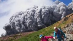 
hot ash flows over air down the side of a volcano at high speed