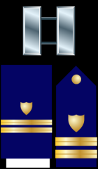 Lieutenant - LT
Collar Device: ZERO TWO silver bars.
Shoulder Insignia: ZERO TWO 1/2-inch gold stripes with a gold shield.
Lacing: Same as Shoulder Insignia.