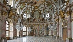 Warzburg Gemany,
all spaces filled,
playful with light,
gold leaf over plaster,
roundness everywhere, 
round ceiling, round engaged columns,
round windows,