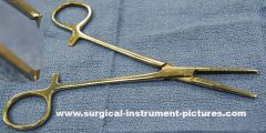 Kocher Forceps : a strong forceps for controlling bleeding in surgery having serrated blades with interlocking teeth at the tips