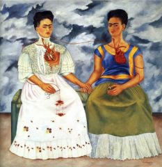 #140 


The Two Fridas 


Frida Kahlo


1939 C.E.


_____________________


Content: An oil on canvas piece containing two self portraits of Frida Kahlo sitting on a bench and holding hands. Each is dressed differently but both have e...