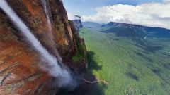 Angel Falls (Salton Angel) in Venezuela is the highest waterfall in the world. The falls are 3230 feet in height with an uninterrupted drop of 2647 feet. Angel Falls is located on a tributary of the Rio Carrion.