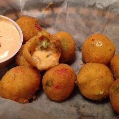 *10 hand battered and fried jalapeño bites filled with Jack cheese and diced red peppers.
*Garnish:
Ranch or 
Cactus Blossom Sauce  
* Served in a deli lined basket