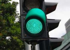 When a traffic signal turns green, you: