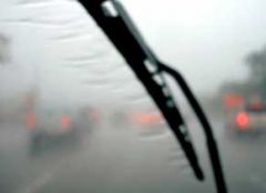 Any time you turn on your wipers due to bad weather, you should also: