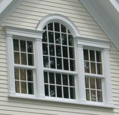 Window is divided into three parts, with rectangular panes on each side of a wide arch. They are placed at the center of an upper story as a focal point in Colonial or Queen Anne houses