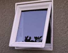 Window that is hinged at the top and opens out