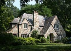 Patterned after the rustic cottages constructed in the Cotswold region of southwestern England since medieval times. Like their Tudor cousins, they are asymmetrical with an uneven sloping roof of slate or cedar that mimics the look of thatch. The ...