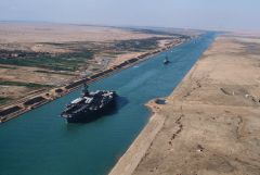 What Egyptian president nationalized the Suez Canal, facing Britain, France and Israel?