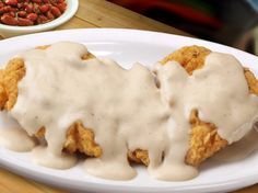 *An 8 oz chicken breast hand battered and golden fried.
Garnish:
*Choice of Cream, Brown, or No gravy 
*Served on Large Warm Oval