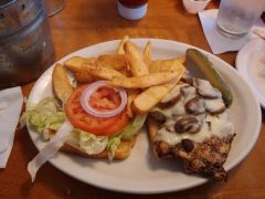 *Grilled chicken breast, sautéed mushrooms and melted jack cheese with lettuce, tomato and onion.  Served on a toasted, Texas-sized bun with steak fries and a pickle spear on the side. (650 cal.)