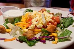 *Mix of Iceburg and Romaine lettuce, Carrots and Red Cabbage. Topped with Diced eggs, Tomatoes, Cheddar cheese, and 5 made -in- house croutons.
*Garnish:
Choice of Dressing