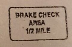This sign means:

A.  Area set aside for for brake inspection in one-half mile.
B.  An area a half mile long is available for inspecting brakes.
C.  Brake inspection mechanics available.
D.  CHP brake check area in one-half mile.