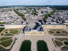 What French king was called the Sun King at the Palace of Versailles and introduced absolute monarchy in his country?